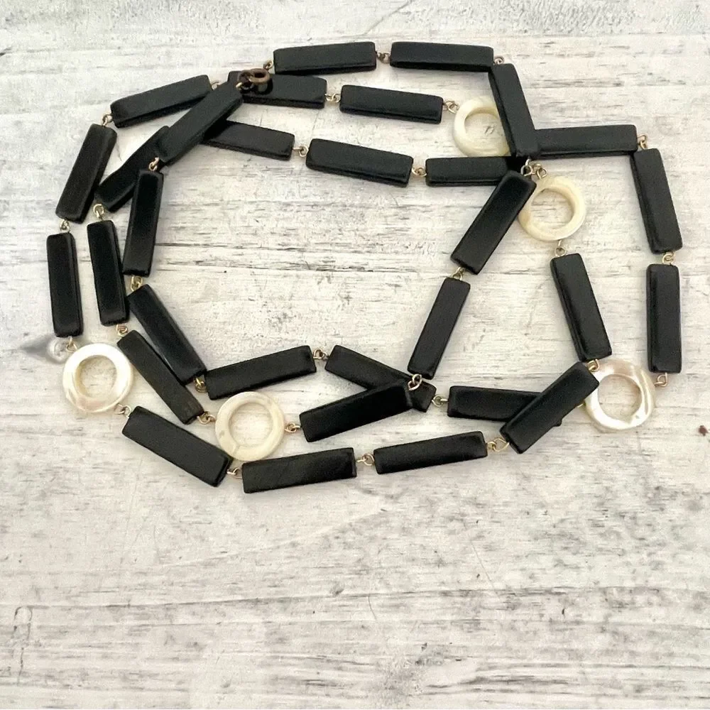 Long black beaded necklace with cream circle beads